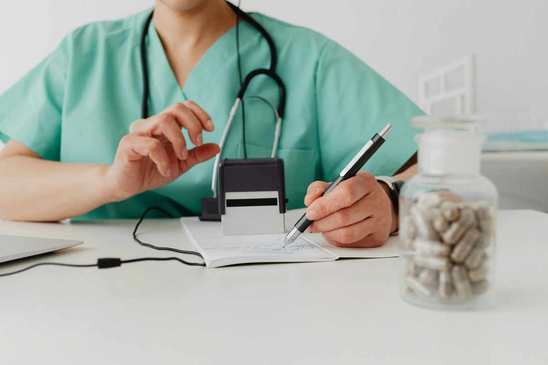 Physician preparing documents for a patient at a medical marijuana dispensary in Texas.